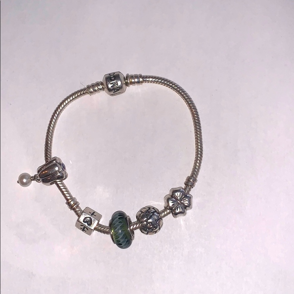 Pandora bracelet with 5 retired charms